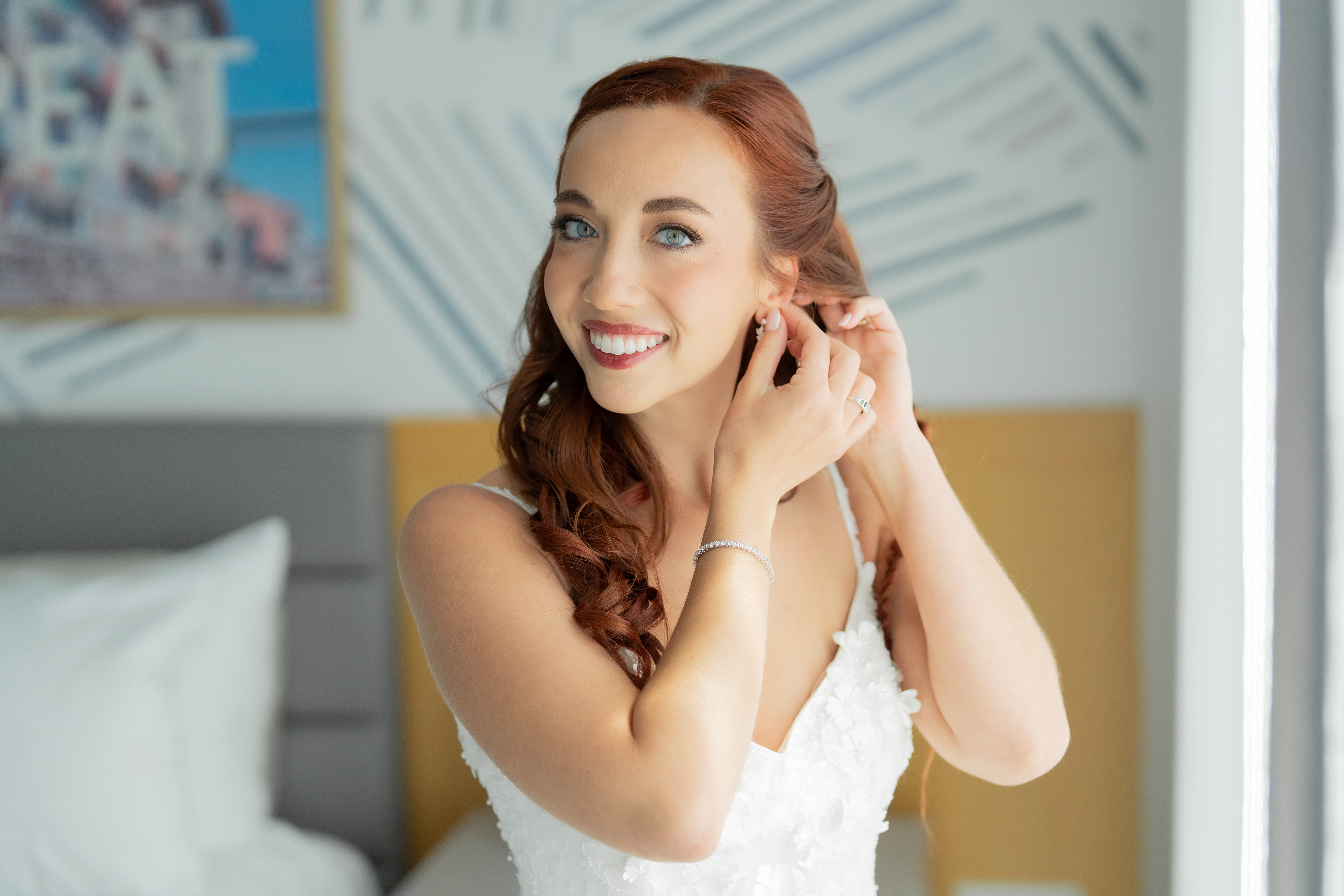 bride getting ready by window at Monsaraz hotel in san diego
